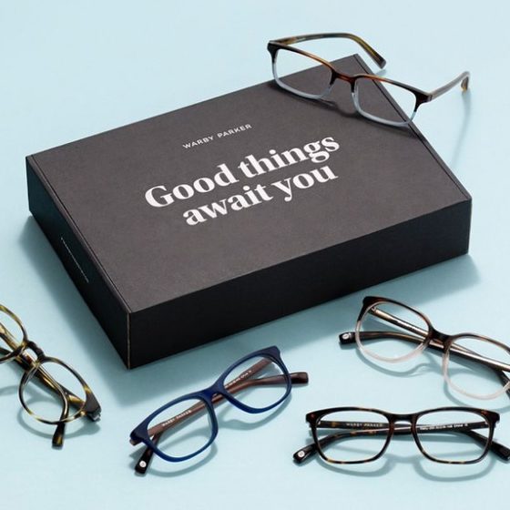 Five pair of Warby Parker glasses with boxing on the bottom