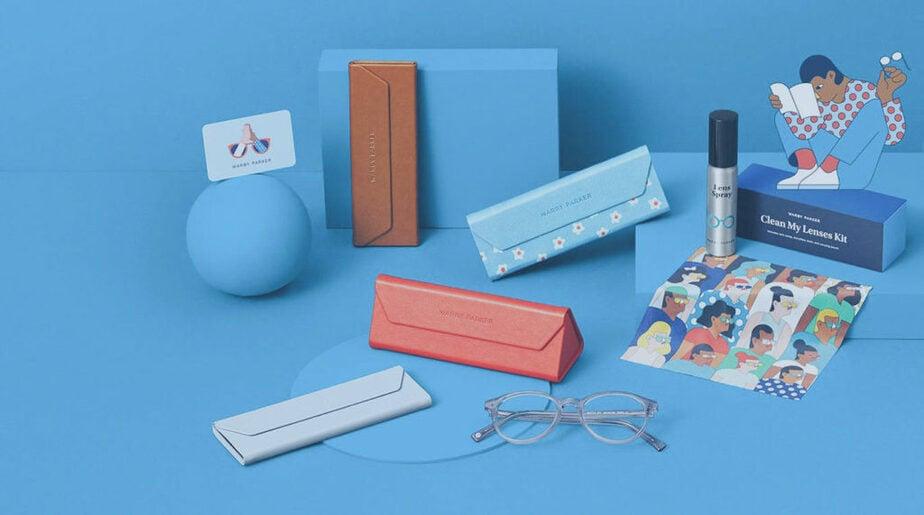 Glass cases, blue branding, Warby Parker items